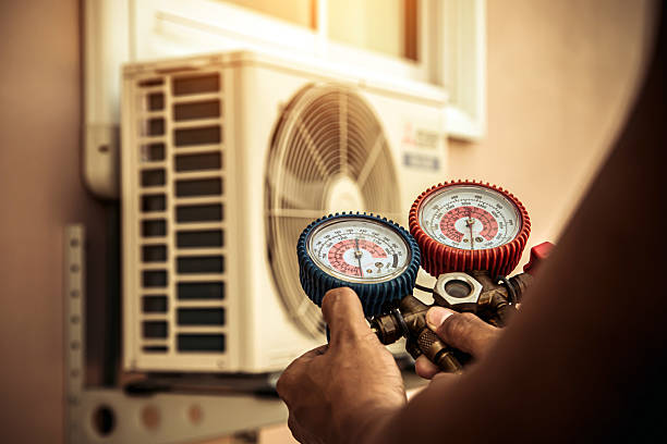 Professional Air Conditioning Service technician working in Osage, WV